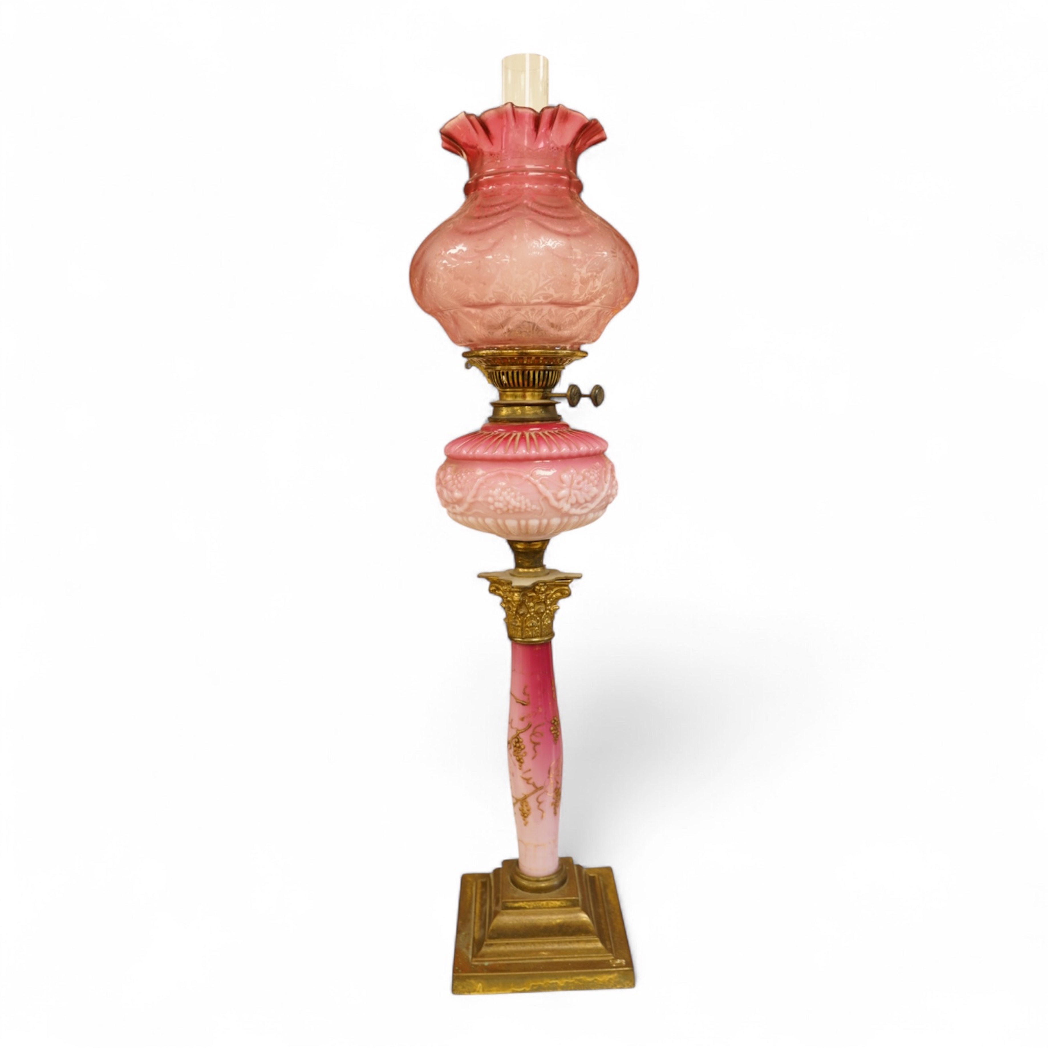 A Victorian brass and ruby glass oil lamp, 80cm high overall